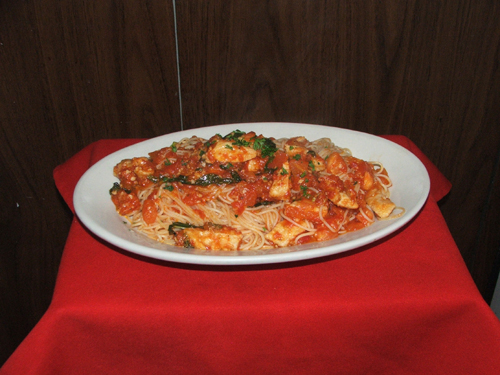 Capellini Con Pollo Al Pomodoro. Angel hair pasta with chicken and pomodoro sauce.