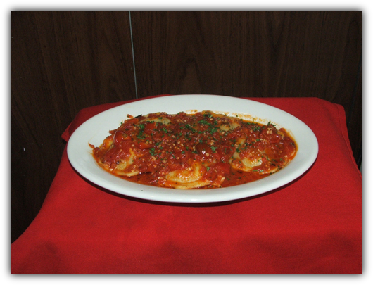 Ravioli Ai Funghi. Stuffed portabello mushrooms with roasted tomatoes.