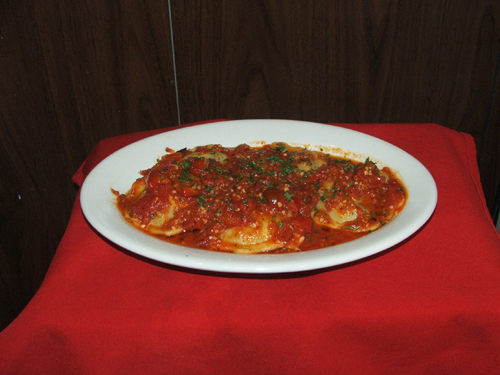 Ravioli Ai Funghi. Stuffed portabello mushrooms with roasted tomatoes.